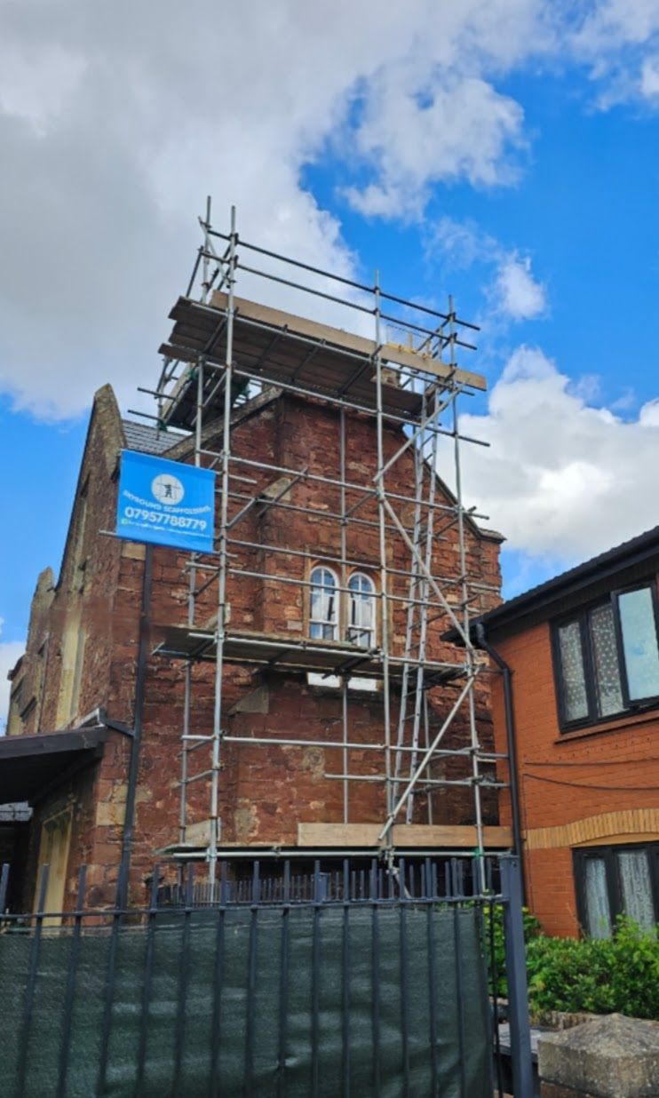 Scaffold access on a tall brick building